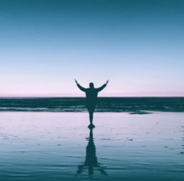 silhouette photography of person standing on body of water